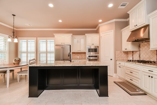 kitchen with sink, a center island with sink, and appliances with stainless steel finishes