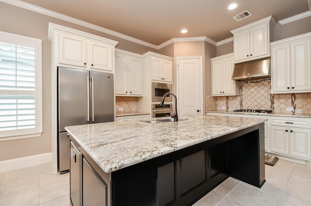 kitchen featuring white cabinetry, appliances with stainless steel finishes, and a center island with sink