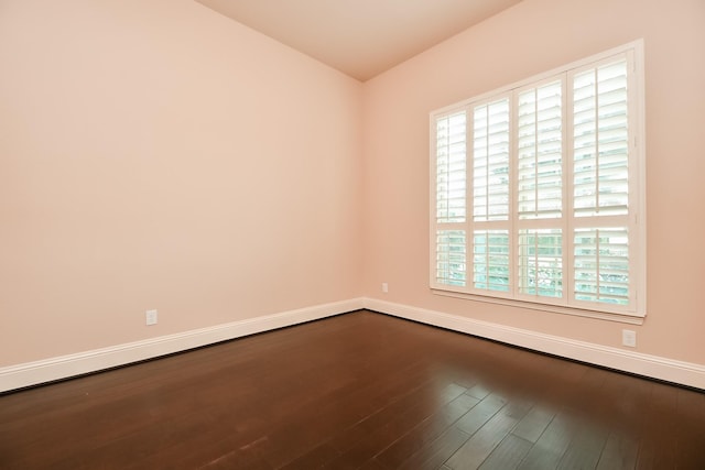 unfurnished room with hardwood / wood-style flooring