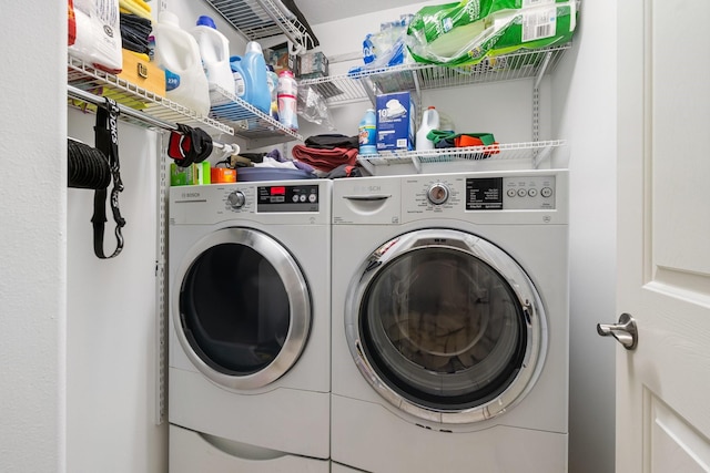 washroom with washer and dryer