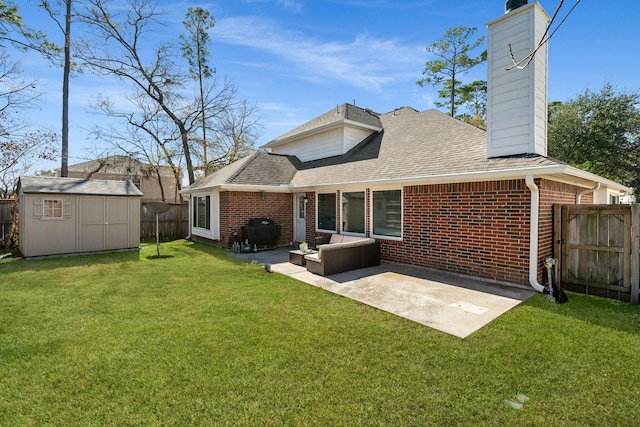 rear view of property featuring a storage unit, outdoor lounge area, a patio, and a lawn