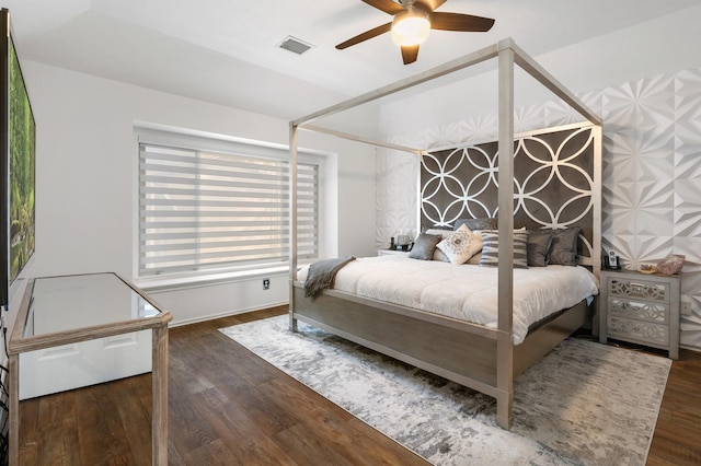 bedroom featuring dark hardwood / wood-style floors and ceiling fan