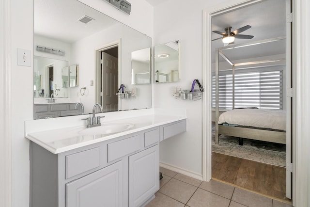 bathroom with vanity, tile patterned floors, and ceiling fan