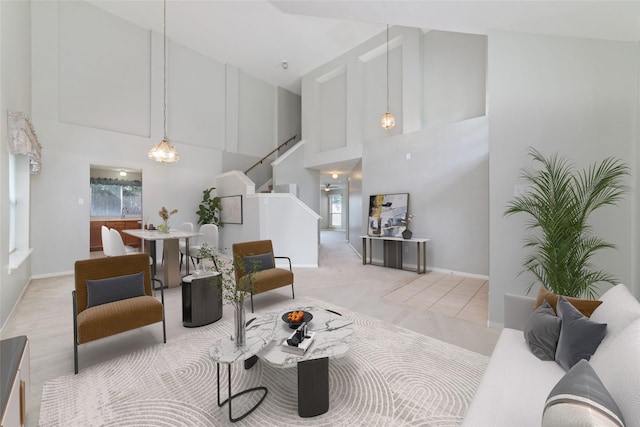 carpeted living room with high vaulted ceiling and a wealth of natural light