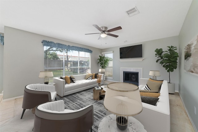 living room featuring light colored carpet and ceiling fan