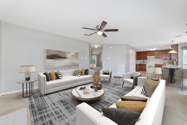 living room featuring light tile patterned floors and ceiling fan