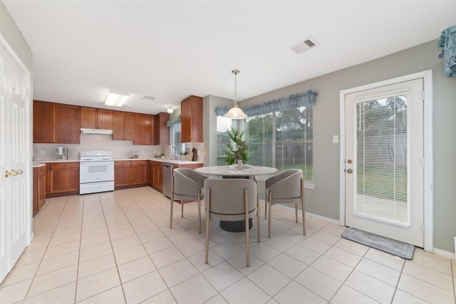 kitchen with electric stove, light tile patterned floors, sink, dishwasher, and hanging light fixtures