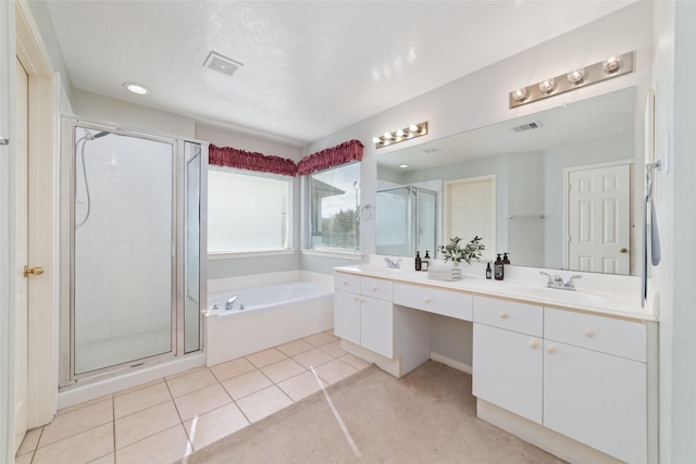 bathroom with vanity, tile patterned floors, and separate shower and tub