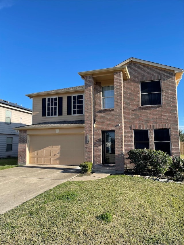 view of front of home with a garage and a front lawn