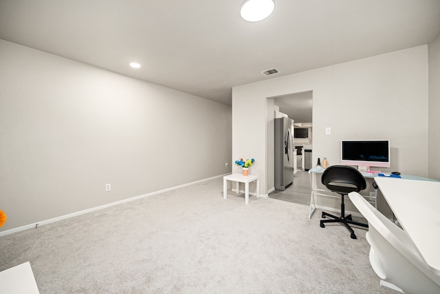 home office featuring light colored carpet