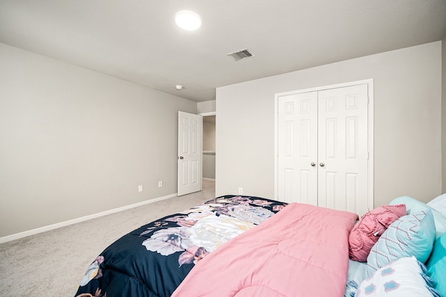 carpeted bedroom featuring a closet