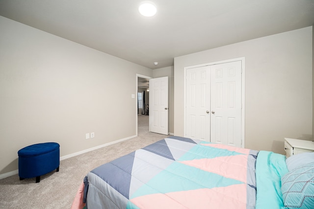 carpeted bedroom with a closet