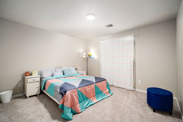 bedroom featuring light colored carpet