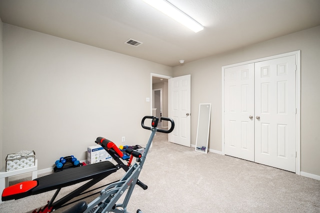 workout room with light carpet