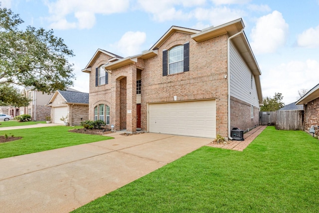 view of front of property featuring a garage and a front yard