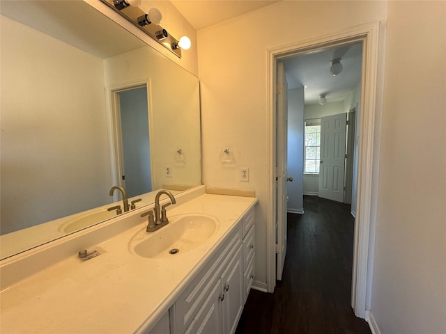 bathroom with vanity and hardwood / wood-style flooring