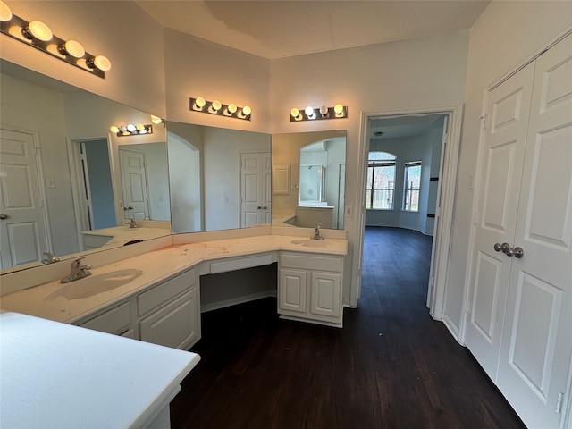 bathroom with vanity and hardwood / wood-style floors