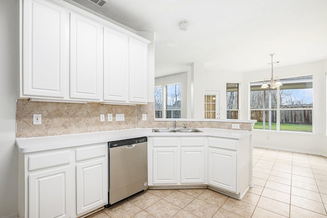 kitchen featuring white cabinetry, light countertops, and dishwasher