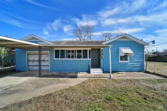 ranch-style house with a carport