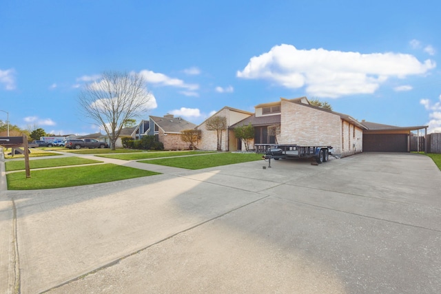 exterior space featuring a garage and a front yard