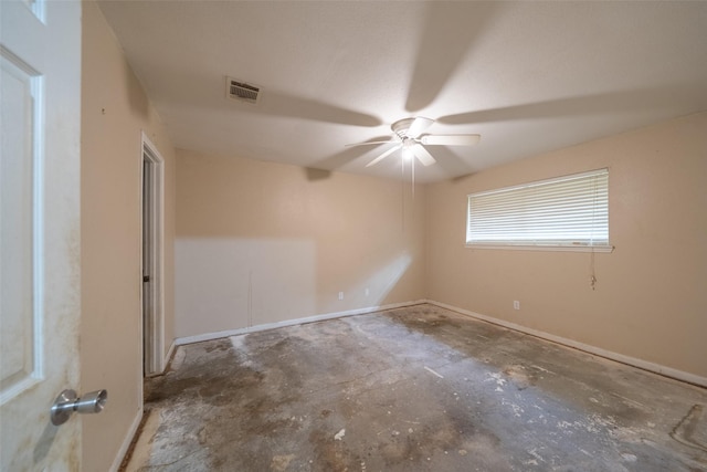 spare room featuring concrete flooring and ceiling fan