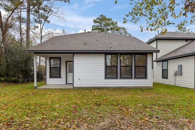 back of house with a yard and a patio area