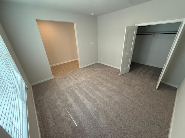 unfurnished bedroom featuring a closet and carpet