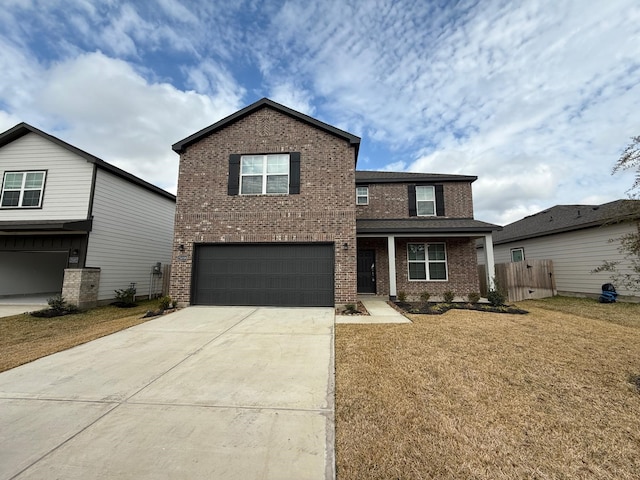 view of property with a garage and a front yard