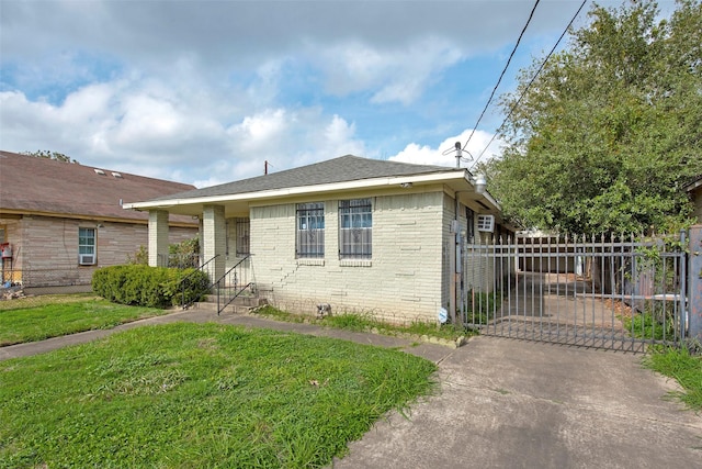 bungalow-style house with a front lawn