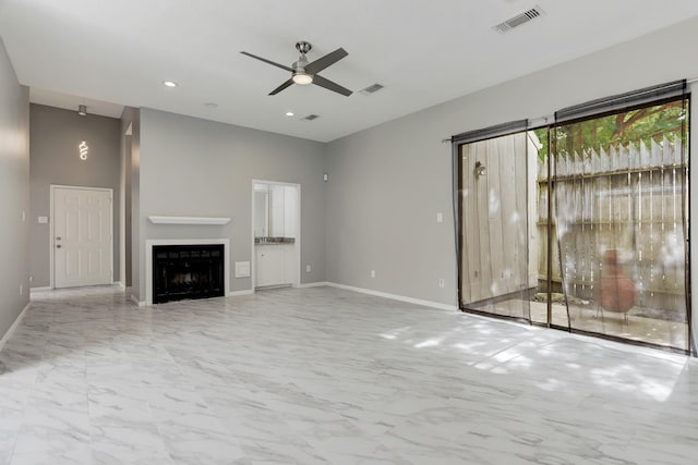 unfurnished living room featuring ceiling fan