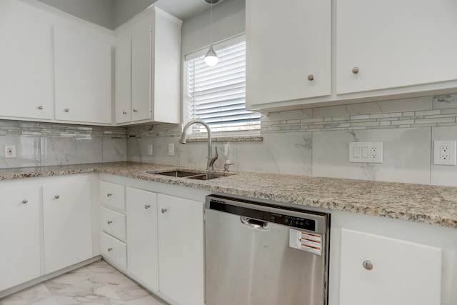 kitchen featuring sink, dishwasher, white cabinetry, decorative backsplash, and decorative light fixtures