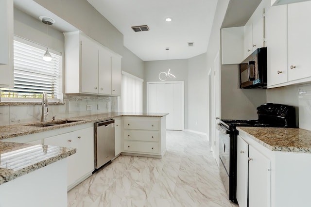 kitchen with sink, pendant lighting, white cabinets, and black appliances