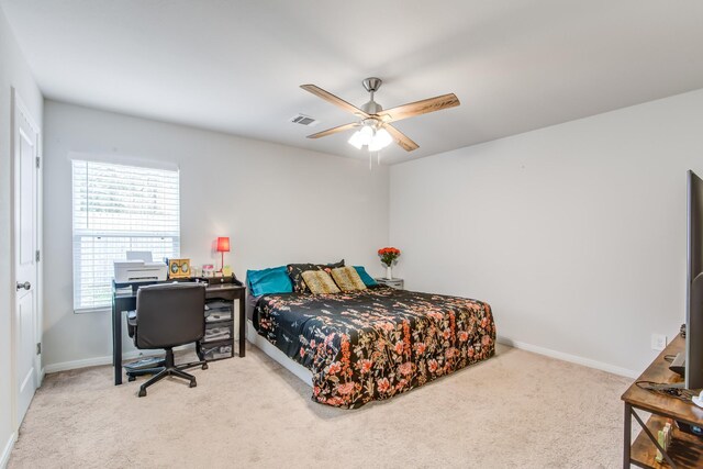 carpeted bedroom featuring ceiling fan