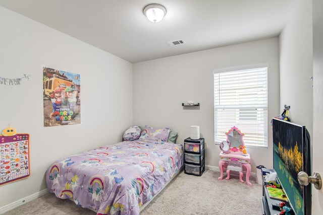 bedroom featuring light carpet