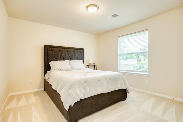 bedroom with light carpet