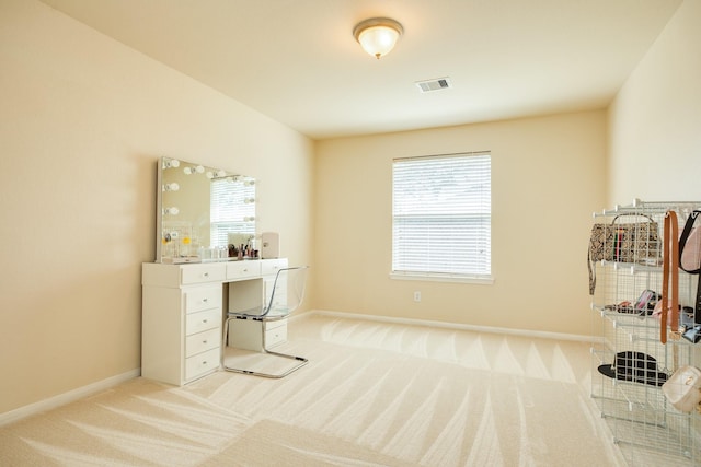 carpeted office featuring a healthy amount of sunlight