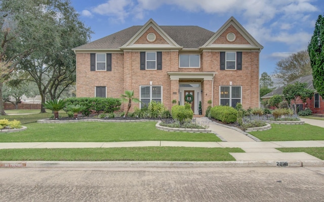 view of front facade with a front yard