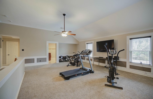 exercise room with lofted ceiling, ornamental molding, and light colored carpet