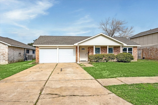 ranch-style house with a garage, a front yard, and central air condition unit