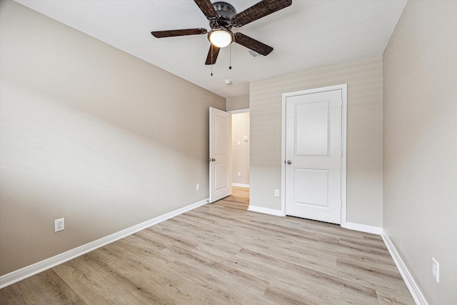 unfurnished bedroom featuring ceiling fan and light wood-type flooring