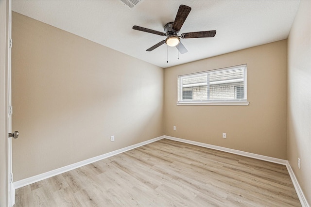 spare room with ceiling fan and light hardwood / wood-style flooring