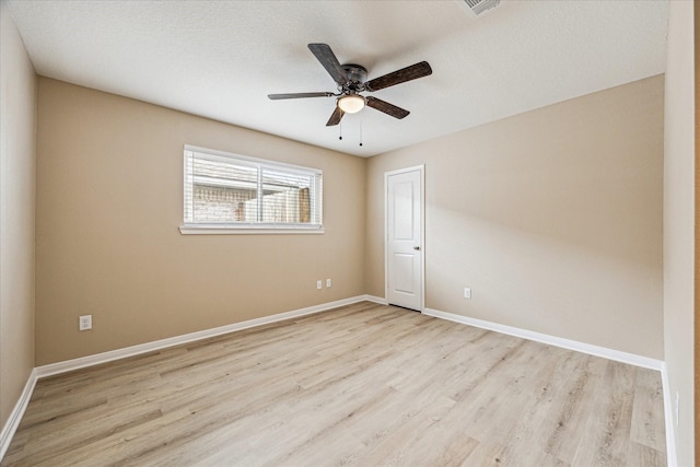 empty room with ceiling fan and light wood-type flooring