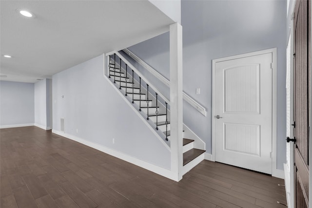 staircase featuring hardwood / wood-style floors