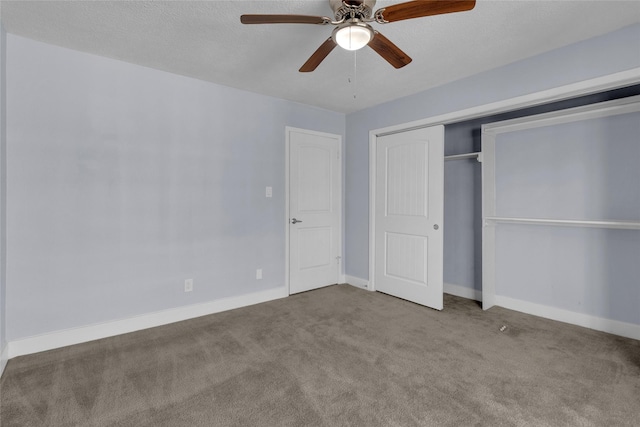 unfurnished bedroom featuring ceiling fan, light carpet, a textured ceiling, and a closet