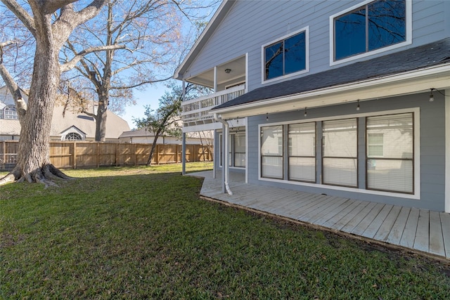 view of yard with a balcony