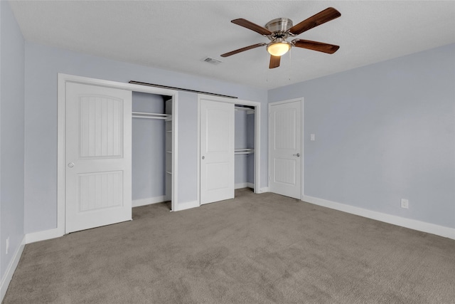 unfurnished bedroom featuring light carpet and ceiling fan