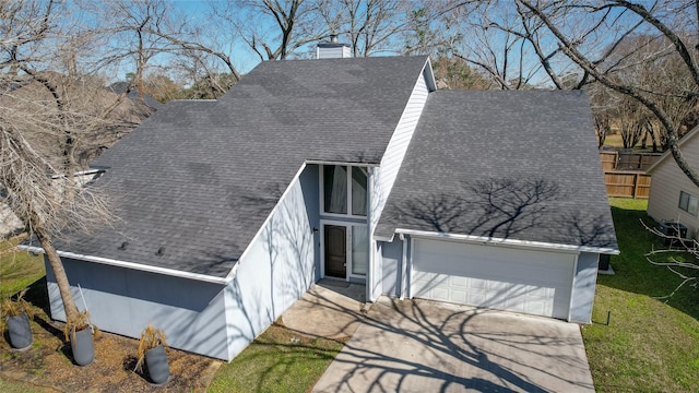 view of front facade with a garage and a front lawn