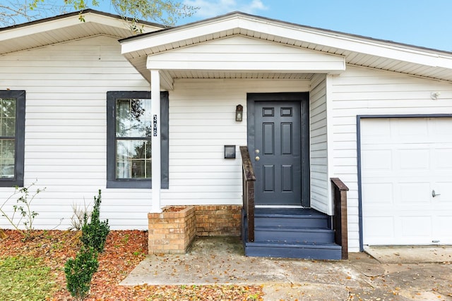 entrance to property featuring a garage