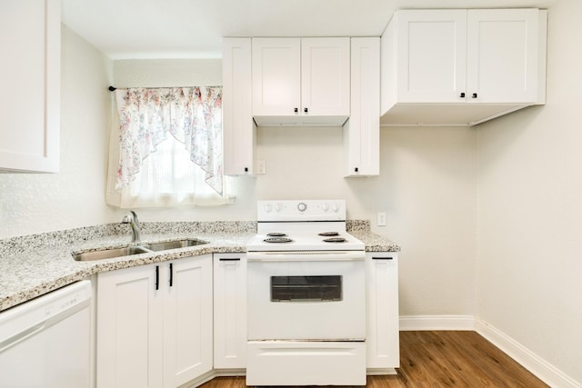 kitchen featuring sink, white appliances, hardwood / wood-style flooring, light stone counters, and white cabinets