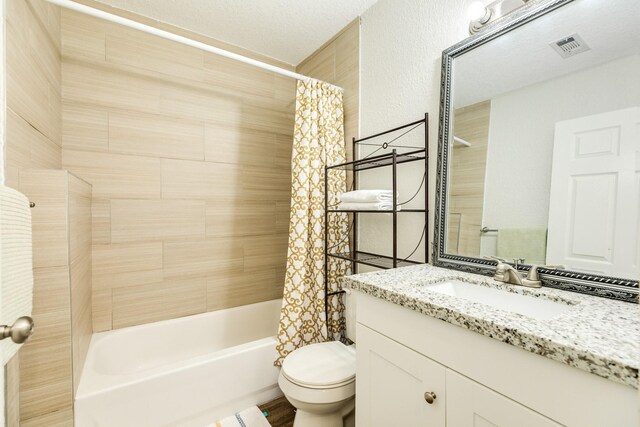 full bathroom featuring shower / bath combination with curtain, vanity, and toilet